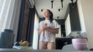 Sexy fit brunette does housework without panties.